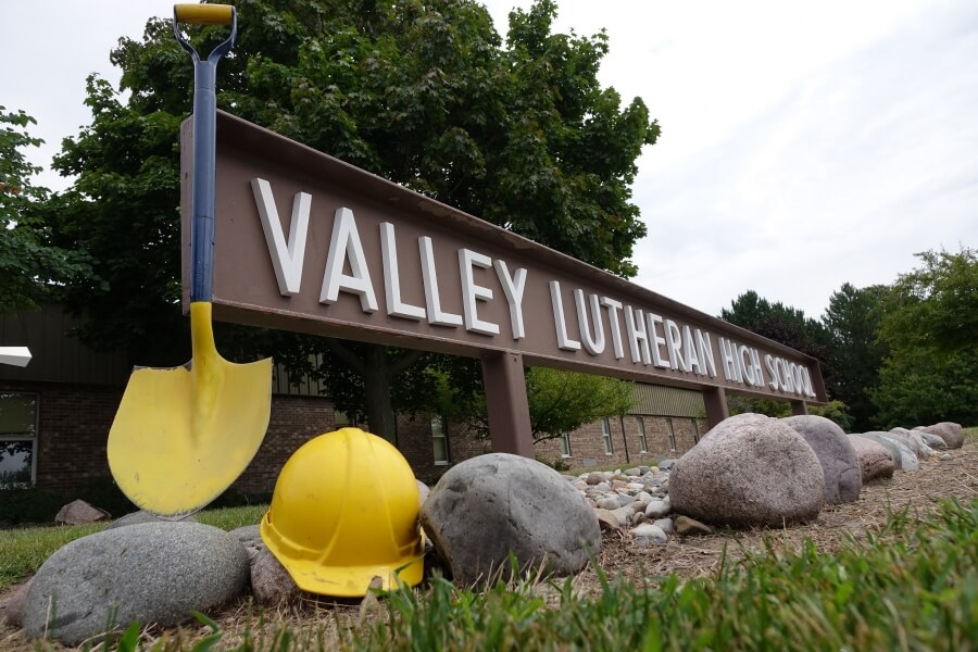 shovel and hard hat next to VLHS entrance